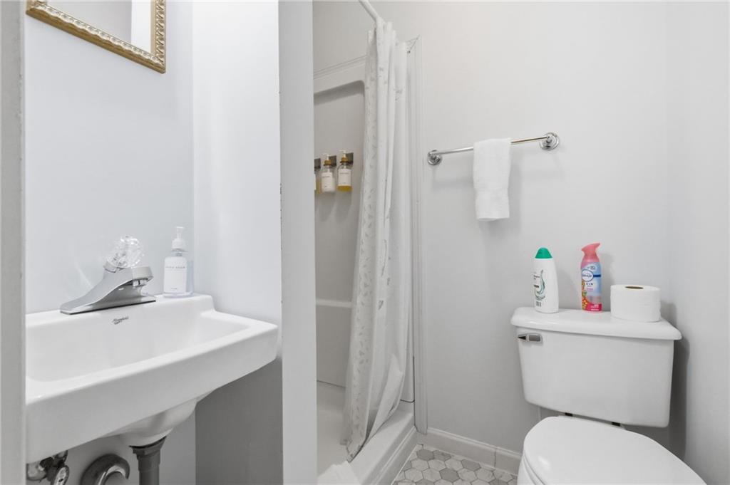 156 Rockdale Road Rockwood, PA 15557 - Photo 23 of 35 a bathroom with a sink toilet and a mirror