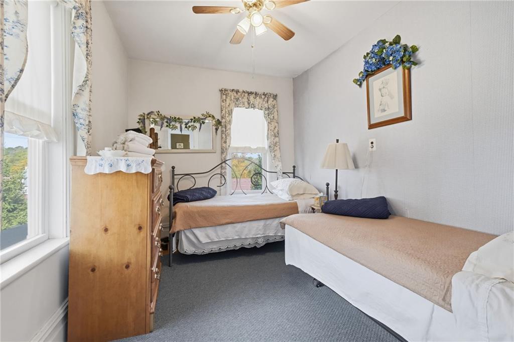 156 Rockdale Road Rockwood, PA 15557 - Photo 25 of 35 a bedroom with a bed and a chandelier