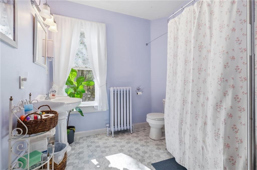 156 Rockdale Road Rockwood, PA 15557 - Photo 27 of 35 a bathroom with a toilet and a shower curtain