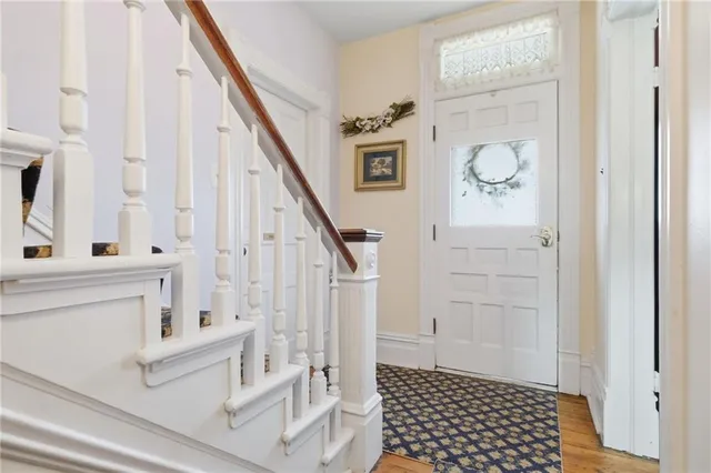 a view of front door with wooden floor