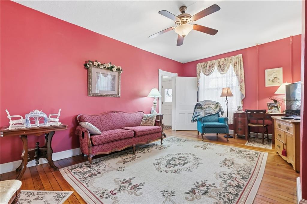 156 Rockdale Road Rockwood, PA 15557 - Photo 9 of 35 a living room with furniture a rug and a chandelier