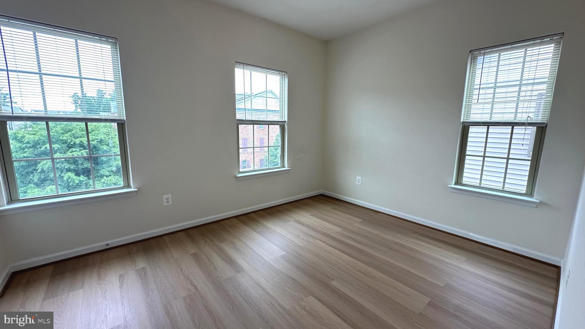 7343 Old Calvary Road Hanover, MD 21076 - Photo 28 of 35 a view of an empty room with wooden floor and a window