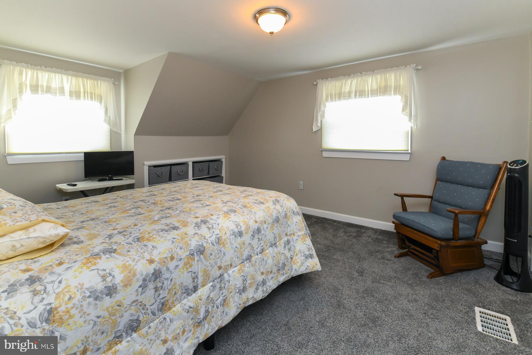 21 Hiawatha Road Somerdale, NJ 08083 - Photo 15 of 22 a bedroom with a bed and a chair