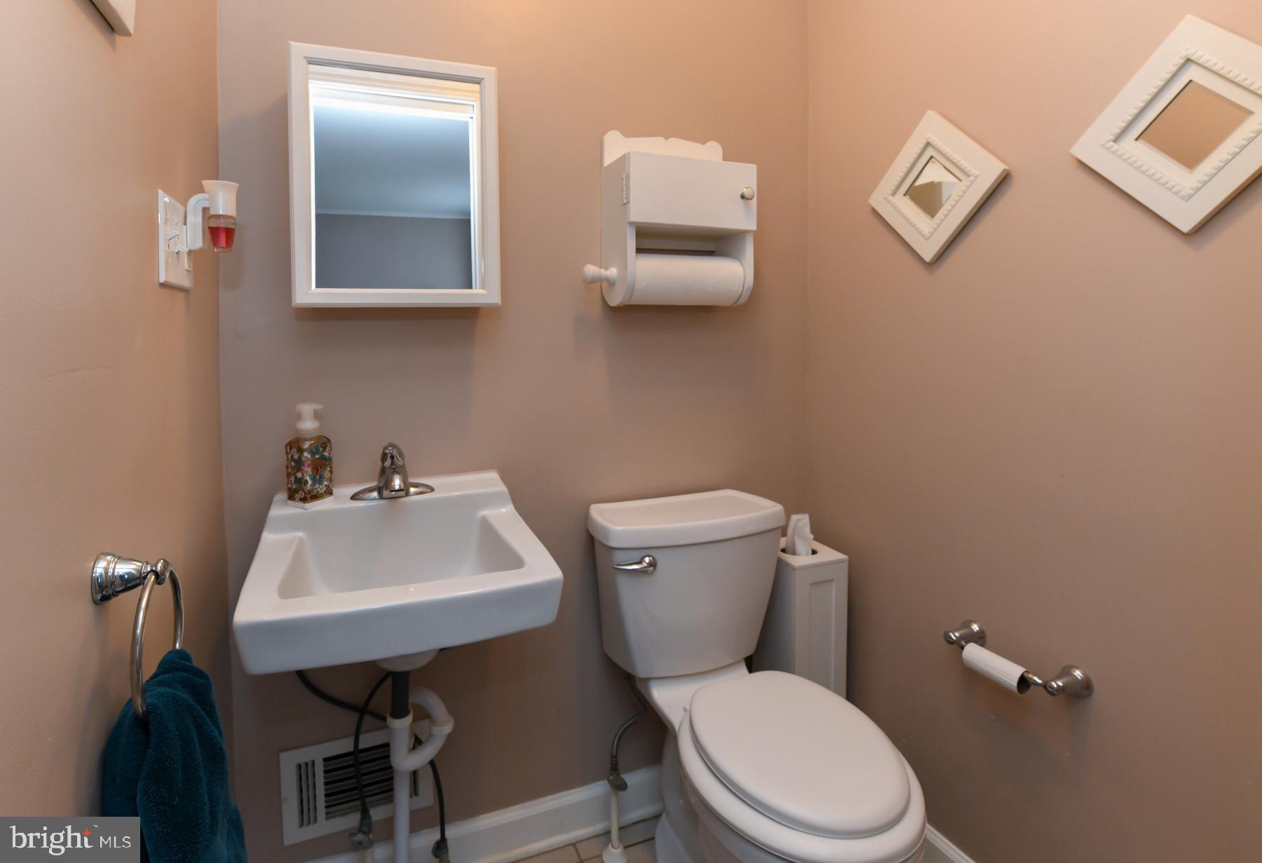 21 Hiawatha Road Somerdale, NJ 08083 - Photo 18 of 22 a white toilet sitting next to a bathroom sink