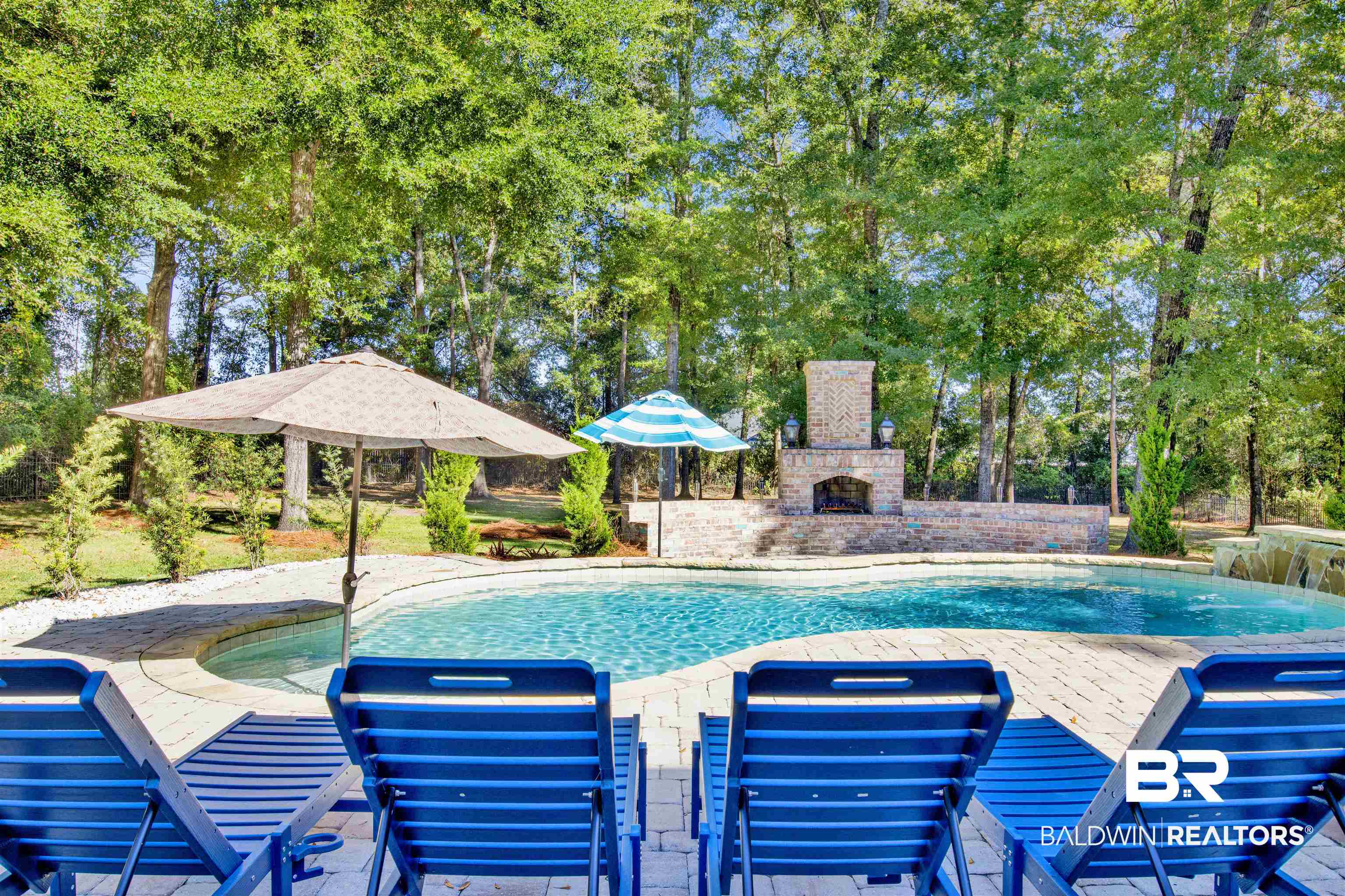 11116 Redfern Road Daphne, AL 36526 - Photo 7 of 46 Outdoor pool featuring a patio area, view of wooded area, and an outdoor brick fireplace