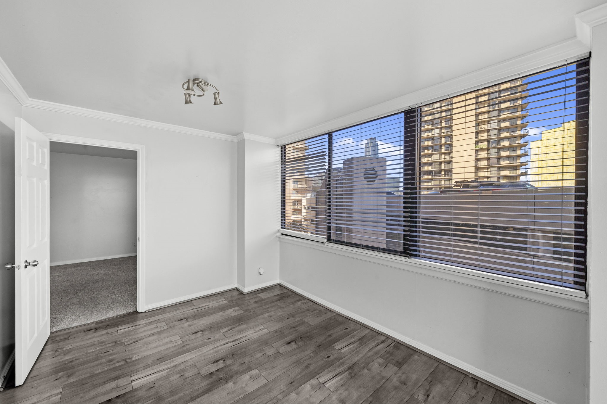 3525 Sage Road, Unit 504 Houston, TX 77056 - Photo 7 of 18 This beautiful dining area is ready for your next dinner party, featuring crown molding details, and large windows showcasing urban views.