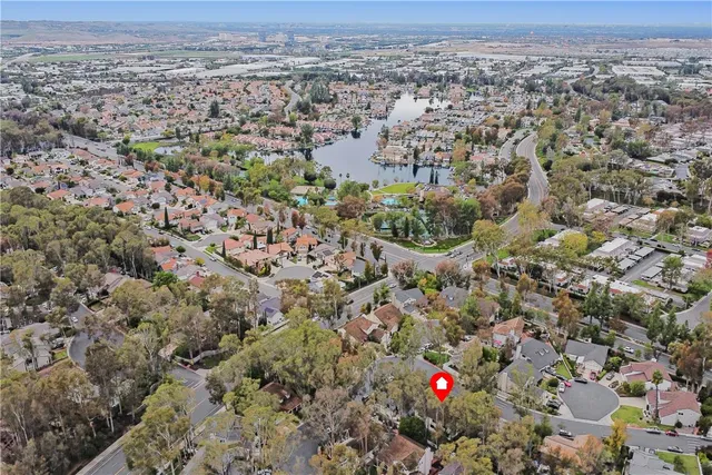 an aerial view of house with yard and mountain view