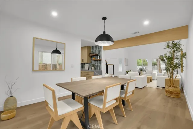 a view of a dining room and livingroom with furniture