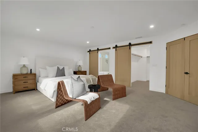 a bed room with a bed and a couch