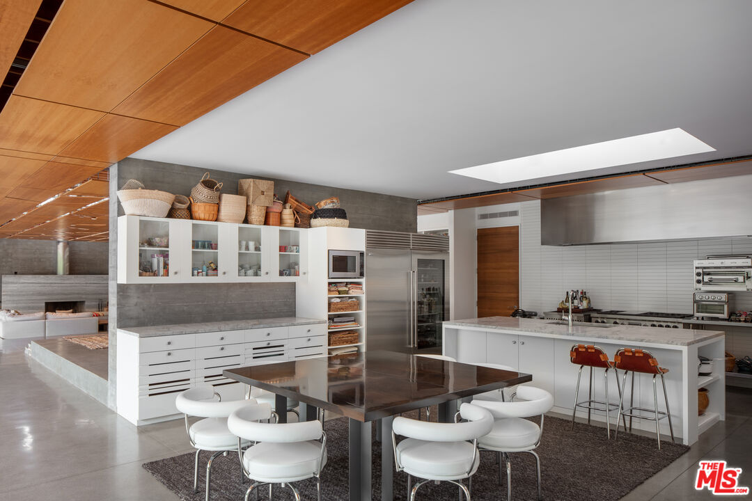 1090 Shokat Drive Ojai, CA 93023 - Photo 8 of 32 a dining room with furniture and a potted plant