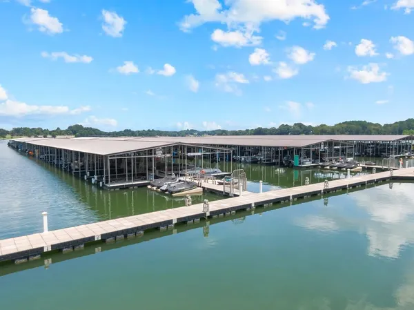 a view of a lake with houses in the background