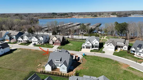 an aerial view of a house with outdoor space