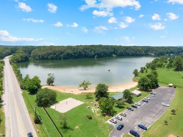 a view of a lake with a yard