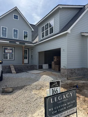 a front view of a house with parking space