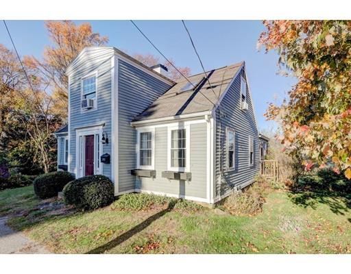 392 South Main Street Cohasset, MA 02025 - Photo 19 of 41 a view of a house with a yard and potted plants