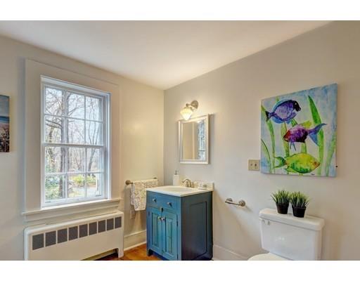 392 South Main Street Cohasset, MA 02025 - Photo 23 of 41 a bathroom with a sink a large mirror and a window