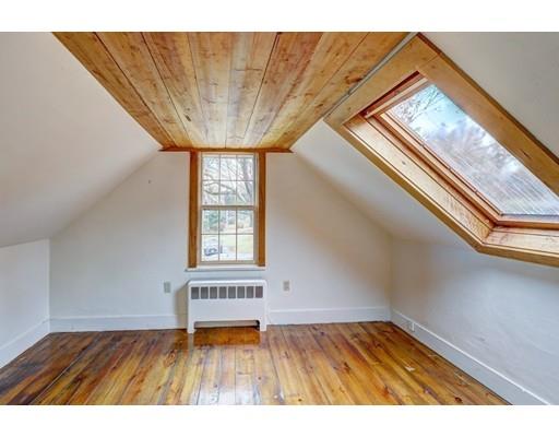 392 South Main Street Cohasset, MA 02025 - Photo 24 of 41 a view of an empty room with wooden floor and a window