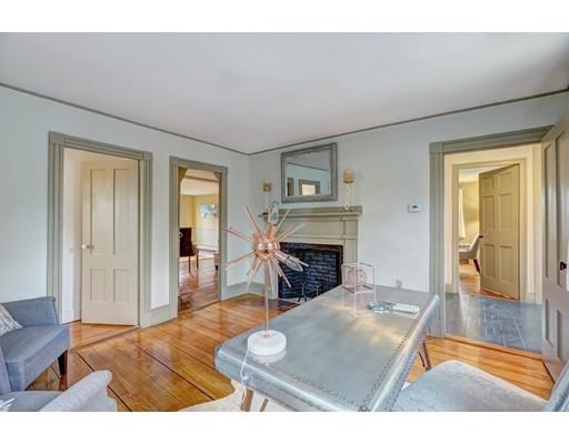 392 South Main Street Cohasset, MA 02025 - Photo 25 of 41 a living room with furniture and a fireplace