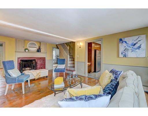 392 South Main Street Cohasset, MA 02025 - Photo 31 of 41 a living room with furniture and a fireplace