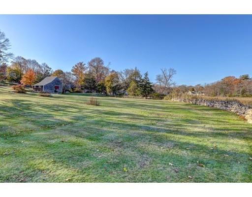 392 South Main Street Cohasset, MA 02025 - Photo 10 of 41 a view of a grassy field with trees