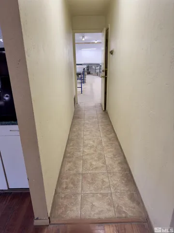 a room with gym equipment and a table
