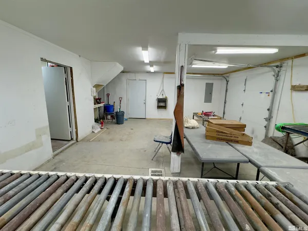 a living room with game table and a table
