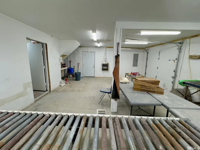 a living room with game table and a table