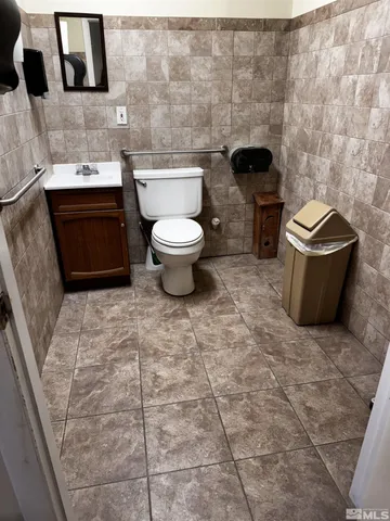 a bathroom with a toilet and a sink