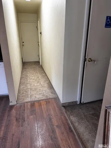 a white toilet sitting next to a white cabinet