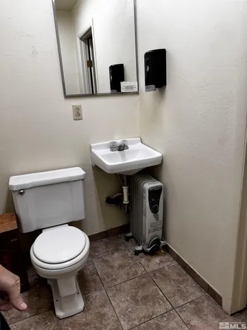a view of a livingroom with furniture a flat screen tv