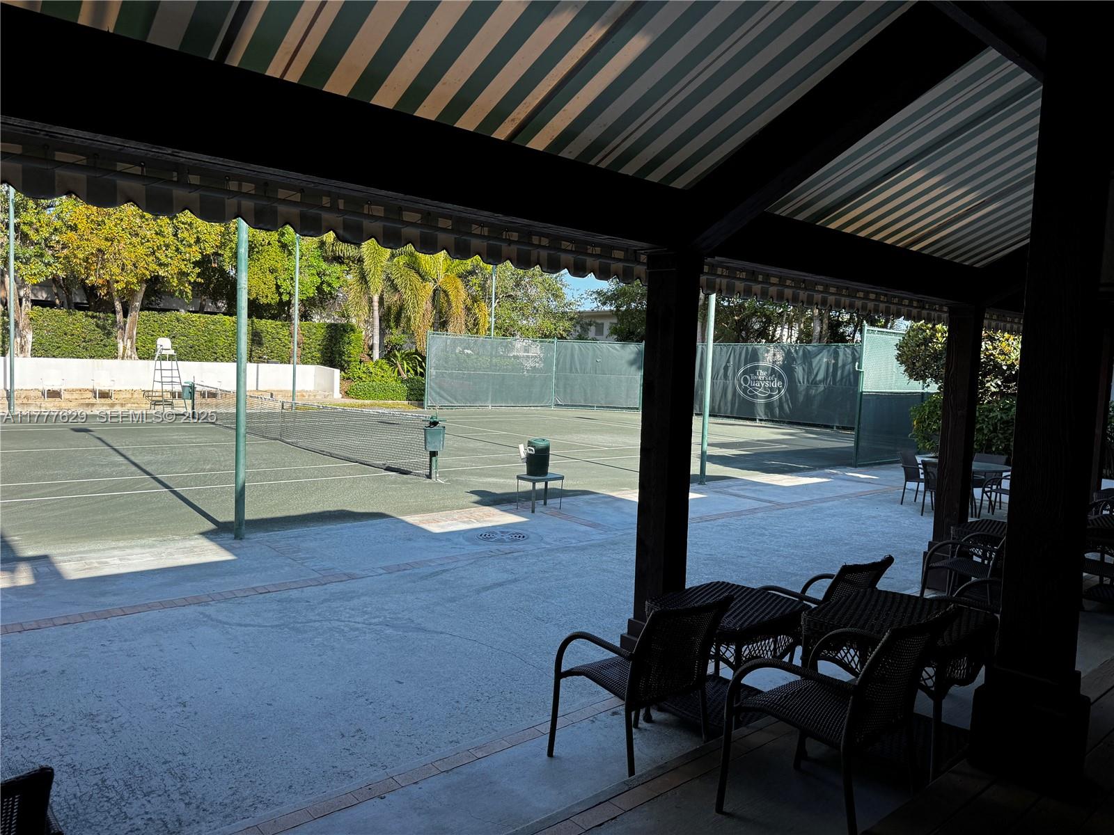 2000 Towerside Terrace, Unit 805 Miami, FL 33138 - Photo 44 of 47 a view of a porch with chairs and backyard