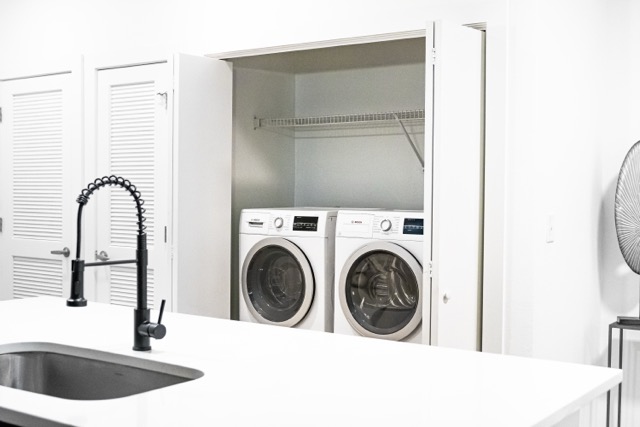 2505 Thornton Road, Unit 2106 Austin, TX 78704 - Photo 13 of 40 a close view of a sink a washer and dryer