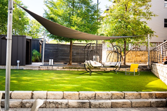 2505 Thornton Road, Unit 2106 Austin, TX 78704 - Photo 32 of 40 a view of a swimming pool with a patio and a garden