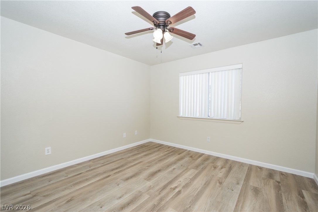 2381 Tough Boy Road Pahrump, NV 89060 - Photo 22 of 44 This airy room features durable flooring and a ceiling fan for optimal comfort.
