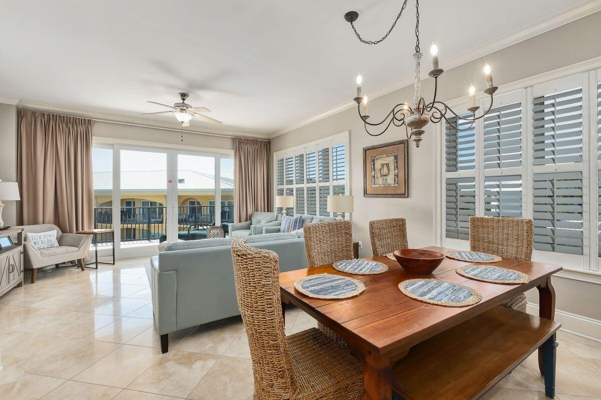 2421 West County Highway 30A, Unit E305 Santa Rosa Beach, FL 32459 - Photo 1 of 39 a view of a dining room with furniture window and outside view