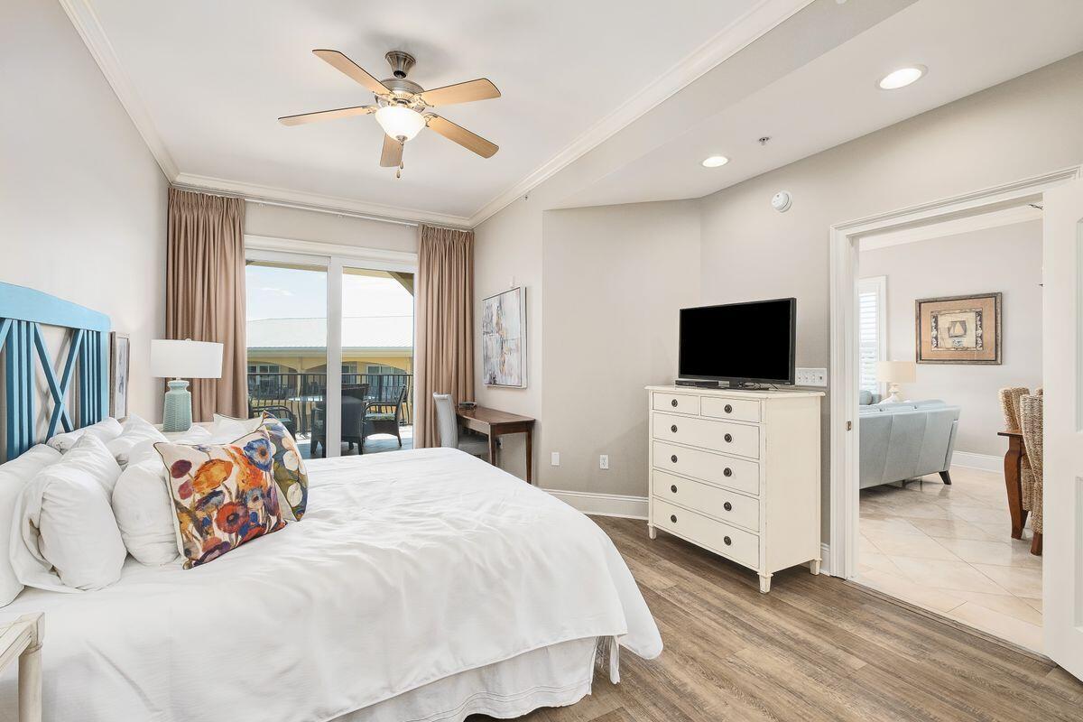 2421 West County Highway 30A, Unit E305 Santa Rosa Beach, FL 32459 - Photo 11 of 39 a bedroom with a bed and a flat screen tv