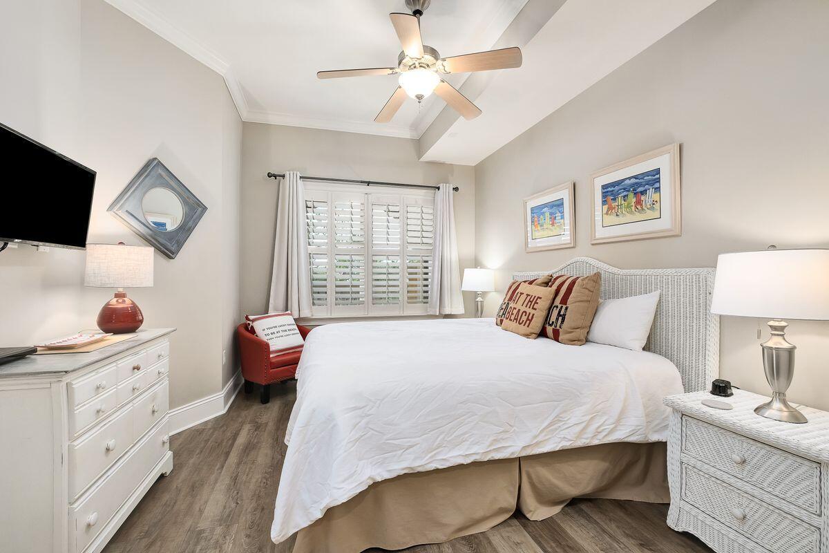 2421 West County Highway 30A, Unit E305 Santa Rosa Beach, FL 32459 - Photo 18 of 39 a bedroom with a large bed and a window