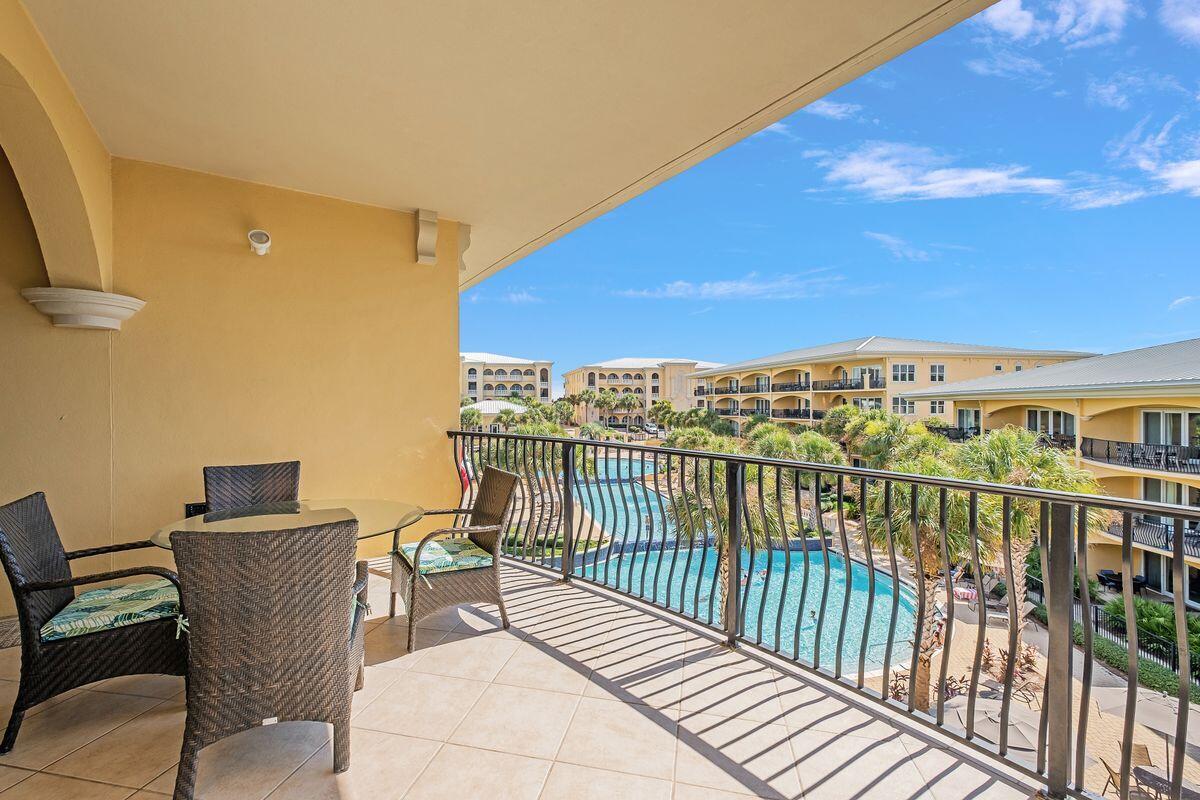 2421 West County Highway 30A, Unit E305 Santa Rosa Beach, FL 32459 - Photo 28 of 39 a view of a balcony with chairs
