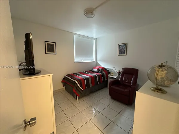 a view of a workspace with furniture and cabinets
