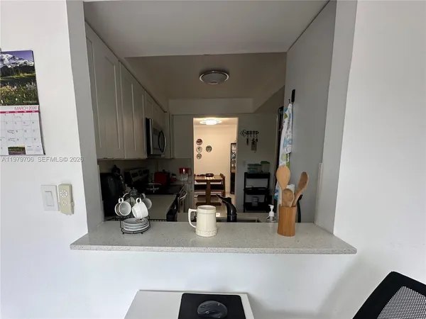 a view of a storage & utility room with a sink