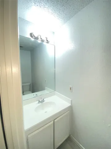 a bathroom with a sink and mirror