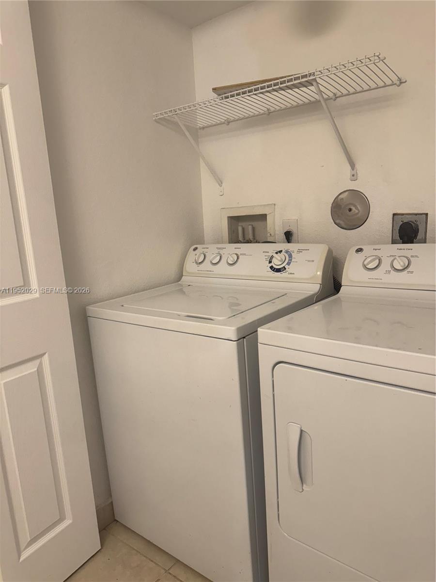 15410 Southwest 284th Street, Unit 8104 Homestead, FL 33033 - Photo 14 of 25 a utility room with dryer and washer