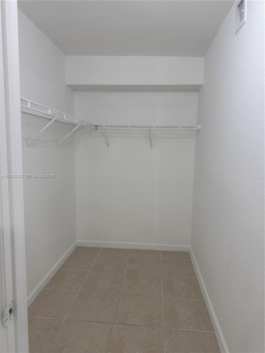 15410 Southwest 284th Street, Unit 8104 Homestead, FL 33033 - Photo 17 of 25 a view of an empty room