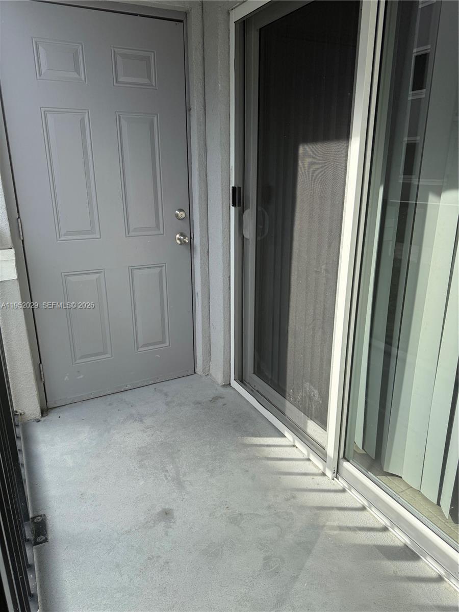 15410 Southwest 284th Street, Unit 8104 Homestead, FL 33033 - Photo 19 of 25 a view of wooden door