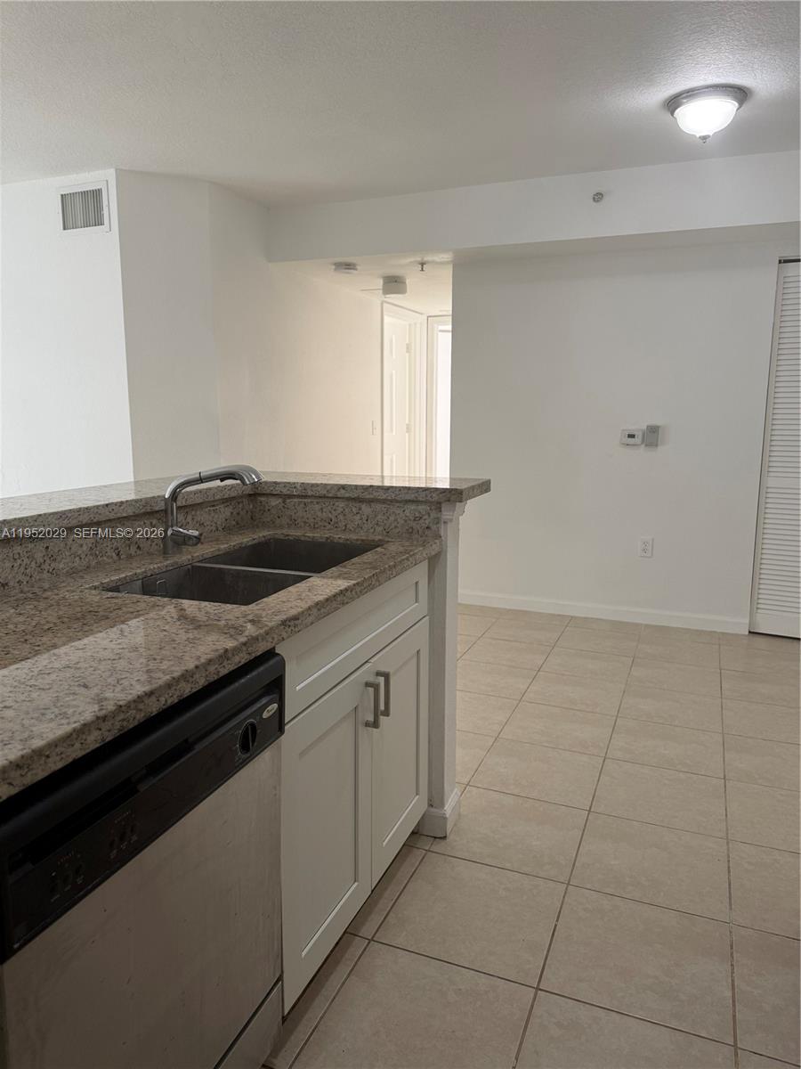 15410 Southwest 284th Street, Unit 8104 Homestead, FL 33033 - Photo 5 of 25 a view of a kitchen counter space and windows