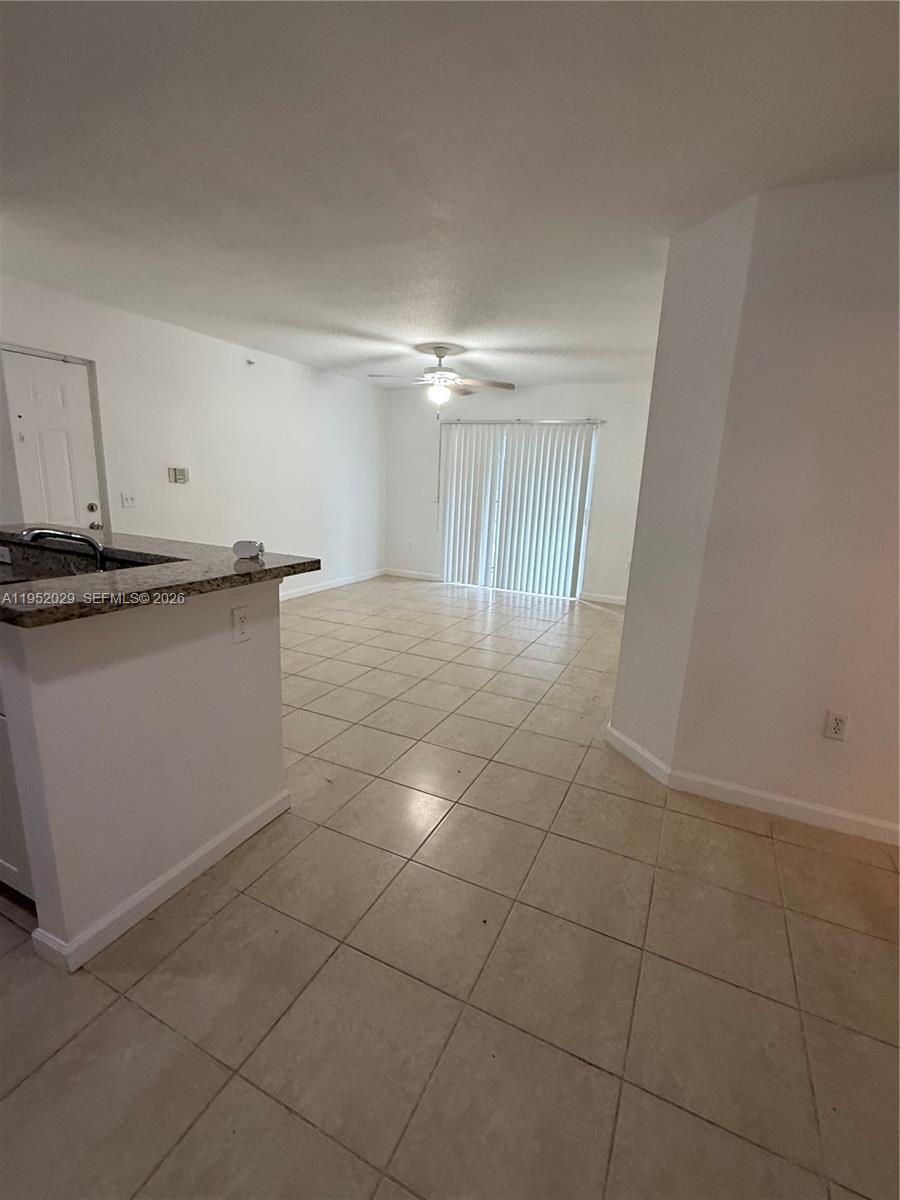 15410 Southwest 284th Street, Unit 8104 Homestead, FL 33033 - Photo 8 of 25 a view of cabinets and wooden floor