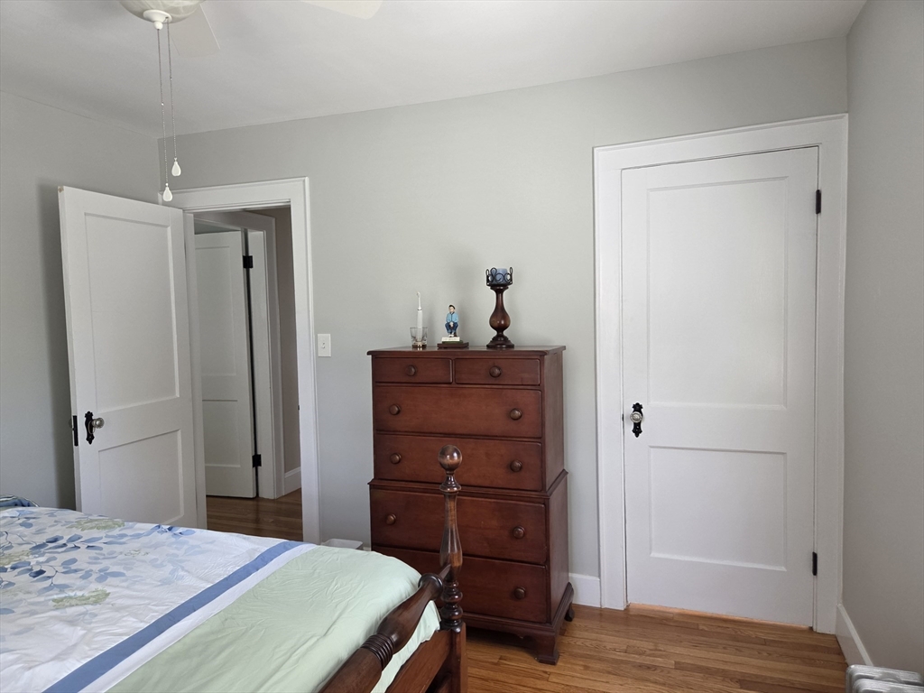 25 Waldeck Road Milton, MA 02186 - Photo 24 of 34 a bedroom with a bed and a dresser