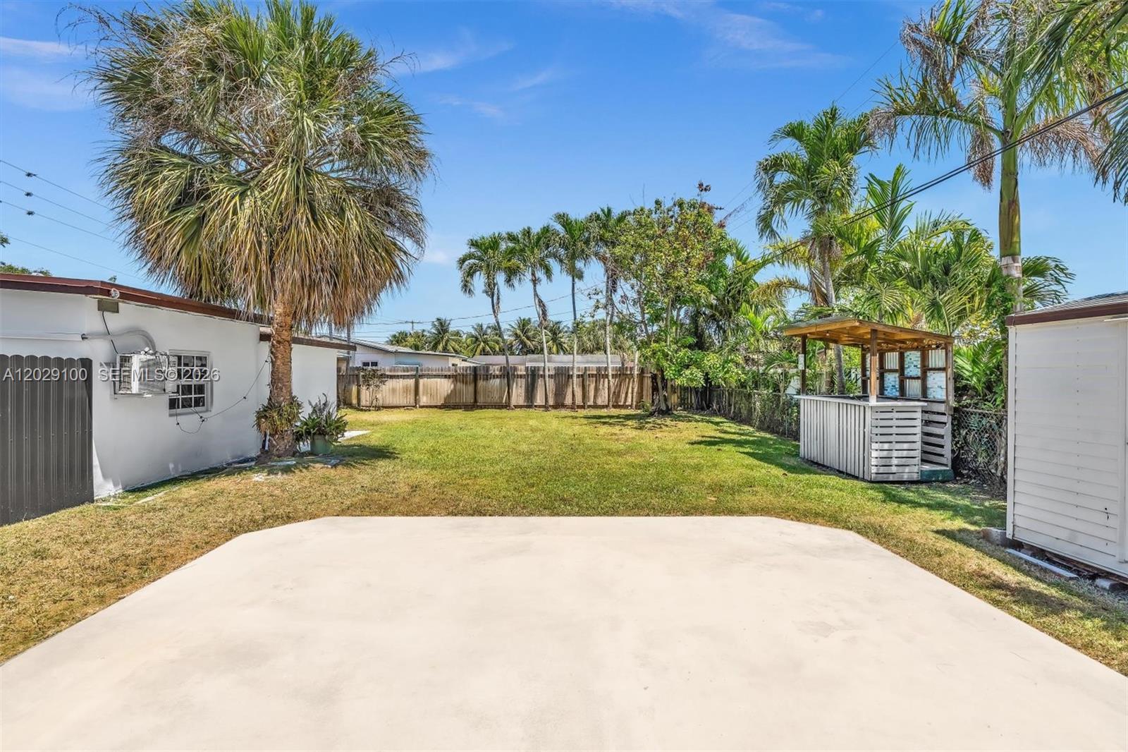 11790 Southwest 34th Street Miami, FL 33175 - Photo 49 of 56 a view of a house with a yard and potted plants