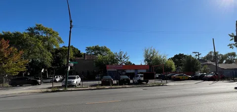 a view of street with parked cars