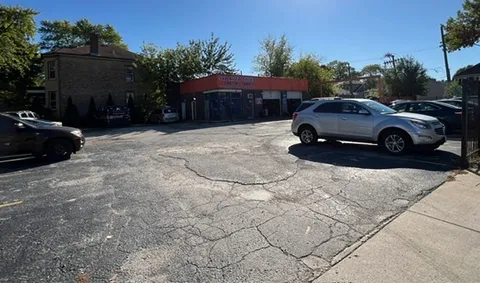 a view of a car parked in front of a house